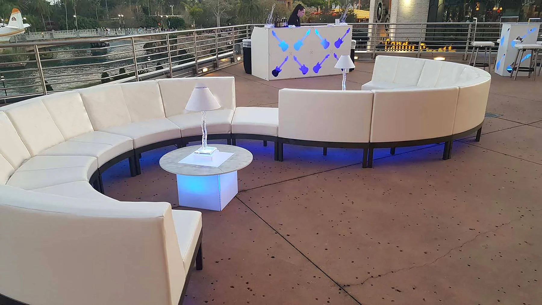 Curving sofa configurations with blue underlight