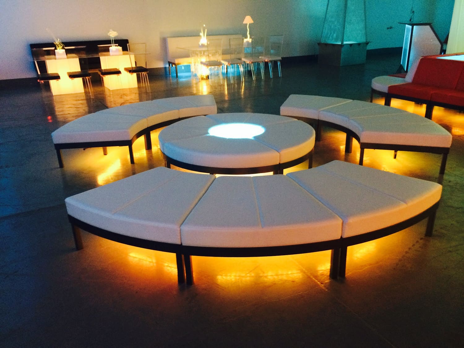 Benches with golden underlight reflecting on the floor