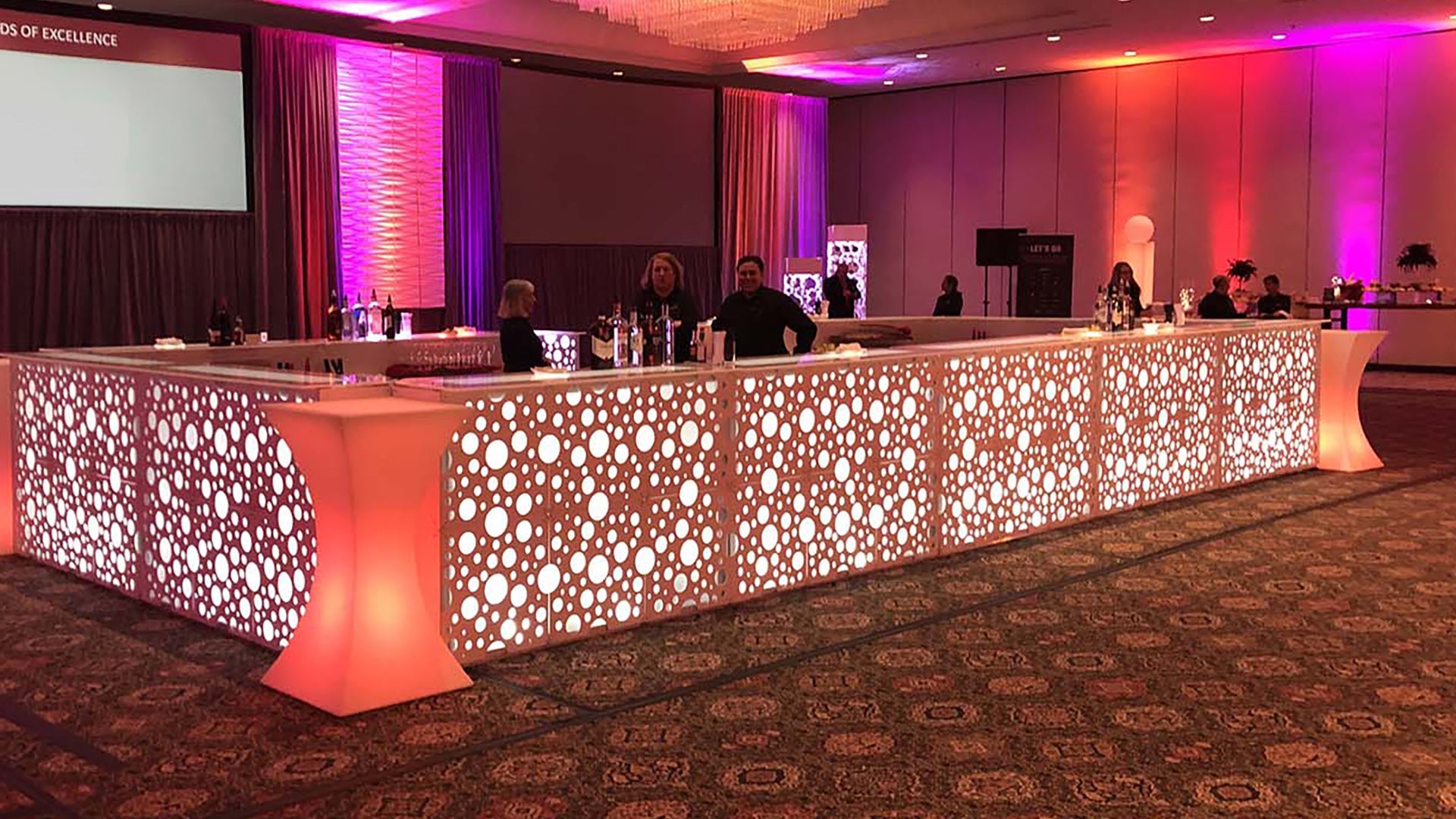 An orange bar with a bubble pattern in purple and red room