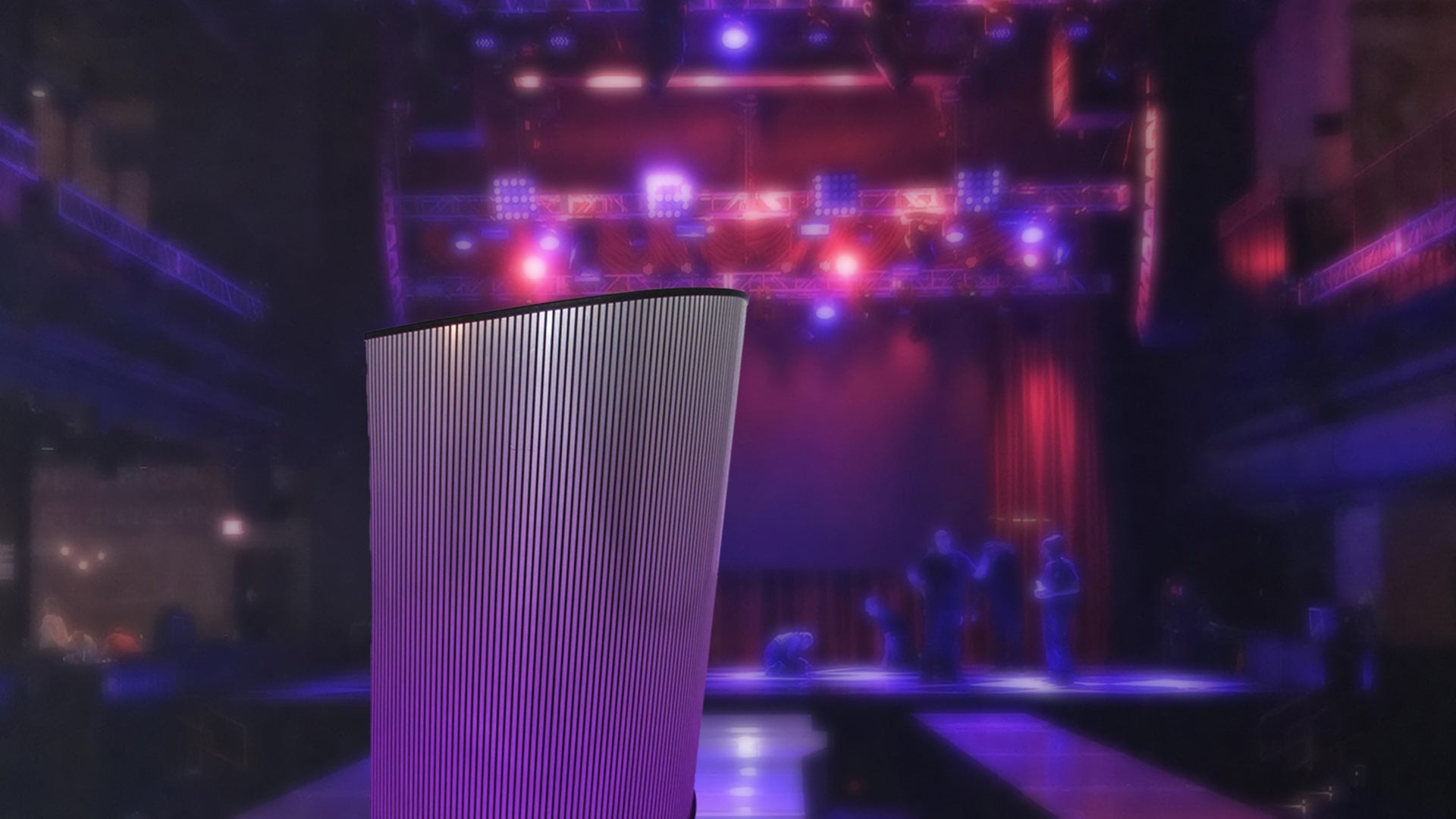 Metal podium set against a purple and red light field